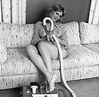 Risque neg. 2044 Model with vacuum on couch  last one.