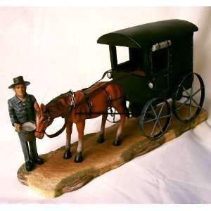  Amish Man Feeding Horse with Black Buggy