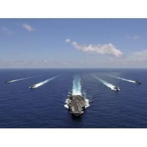 The Aircraft Carrier USS Abraham Lincoln Leading a Formation of Ships 