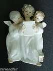 Lladro group figurine of three singing angels   marked