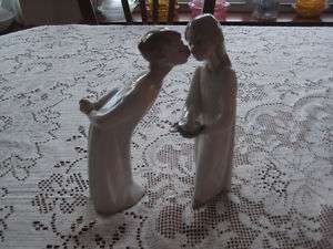 LLADRO BOY KISSING AND GIRL WITH CANDLE  
