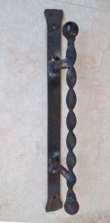 Rusty twisted blacksmith wrought iron door handle pulls  