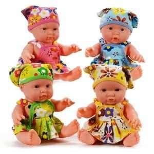  BABY DOLL WITH FLOWERED DRESS. Includes matching headscarf 