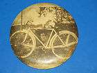   CELLUOID & METAL PICTURE OF MAN & BICYCLE,COLUMBIA STUDIO CHICAGO