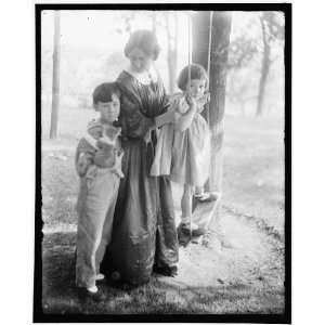  Mrs. Turner holding daughter,who is standing on swing 