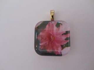   have been set in beautiful clear glass tiles or pendants settings